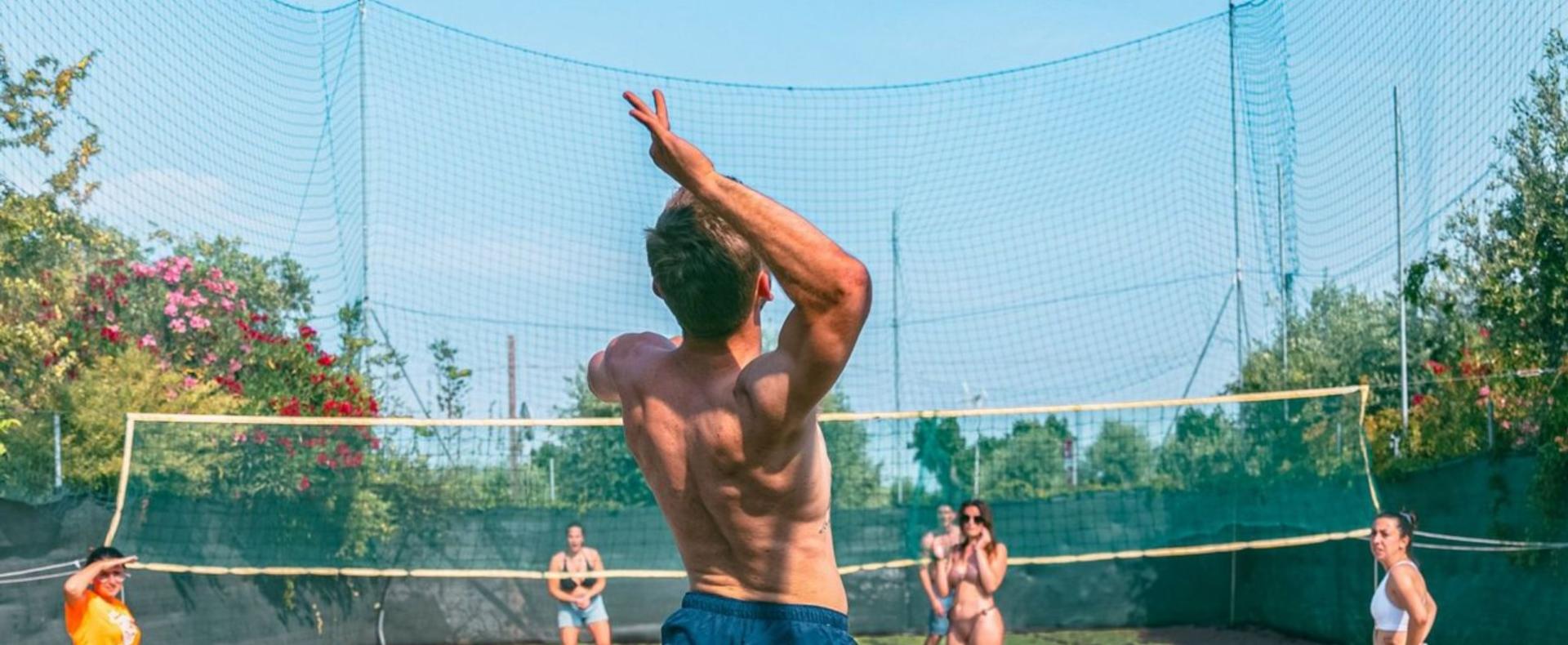 Outdoor volleyball game with friends on a sunny day.